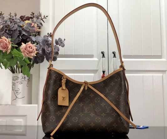 Louis Vuitton Alma Carryall MM in Tela Monogram